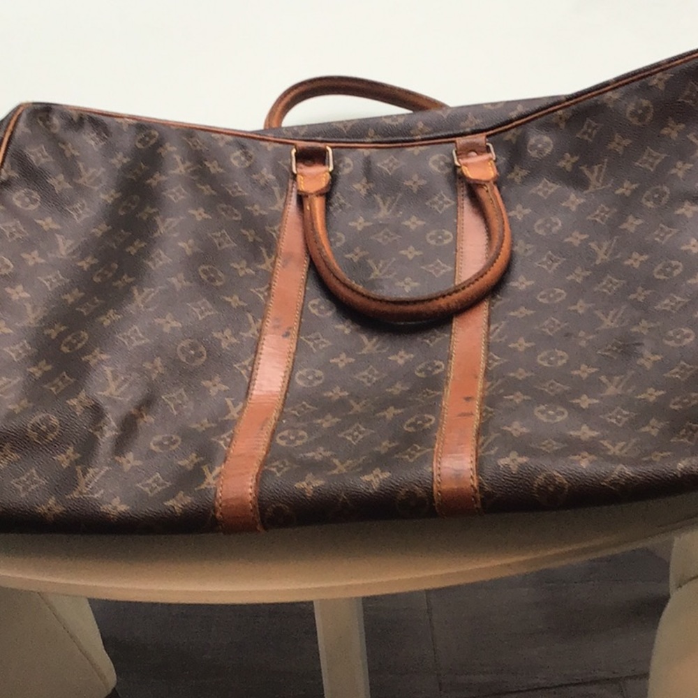 Vintage Louis Vuitton suitcase. signs of wear